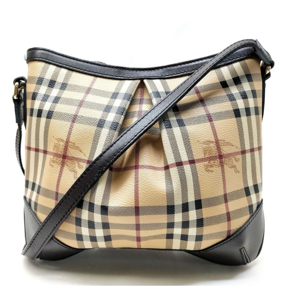 Burberry Cream and Black Crossbody Bag with Iconic Design
Burberry Nova check